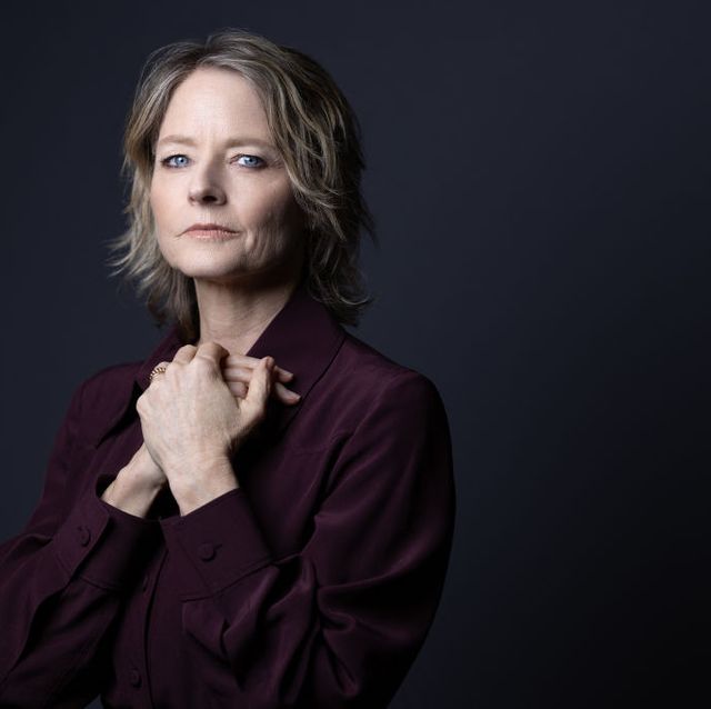 jodie foster looking ahead in a portrait photo and holding her hands against her chest