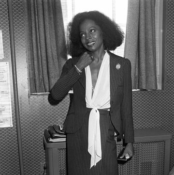 actress and singer diana ross, wearing a pinstripe skirtsuit with a white, tie front blouse, being interviewed in new york