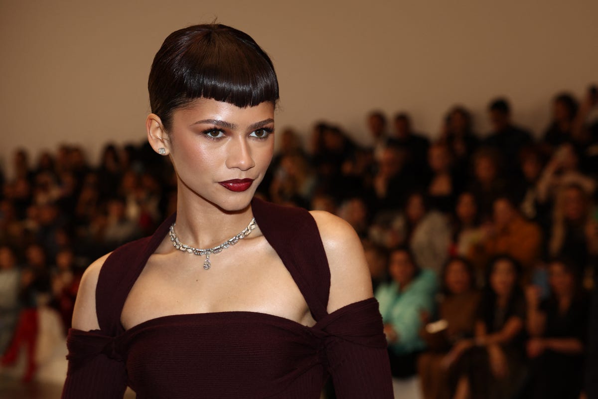 Zendaya Arrives at Fendi's Paris Show in a Plum Gown and Micro Bangs