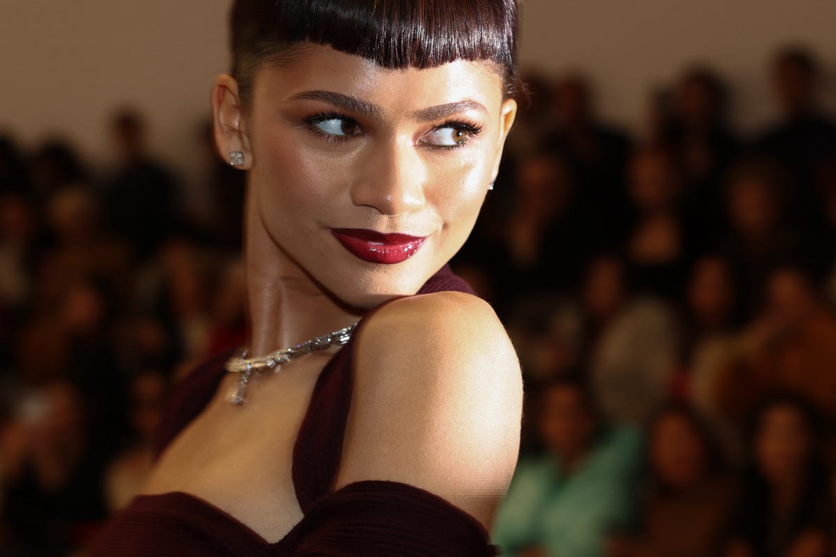 Zendaya Wears Maroon Gown With Micro Bangs to Fendi’s Show