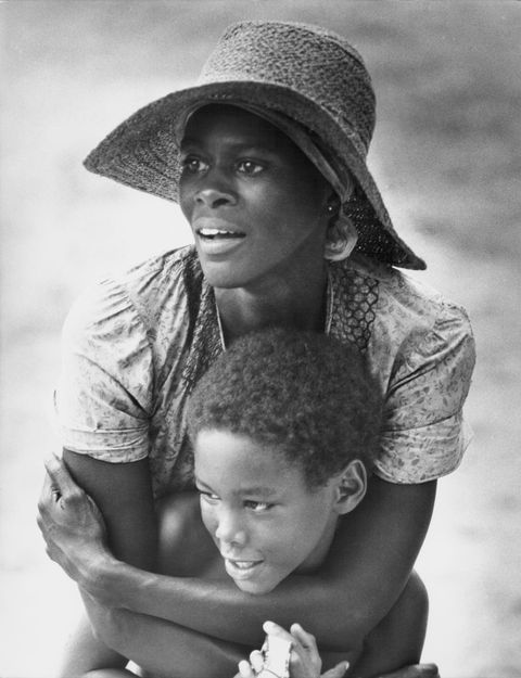 cicely tyson, playing rebecca in sounder, has her arms around her on screen son
