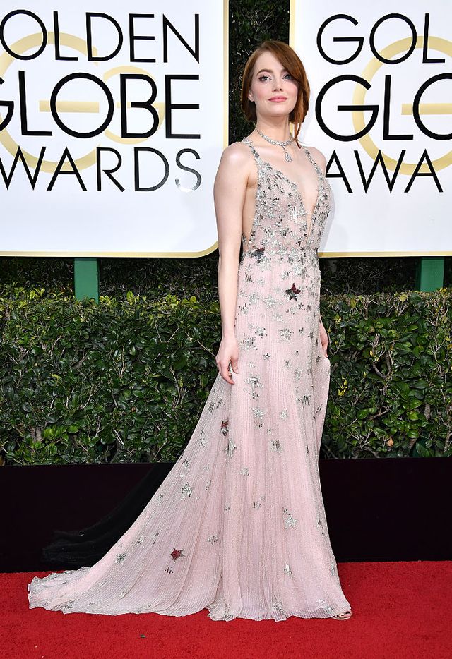 Emma Stone wearing a SS19 dress, pumps, a clutch and earrings and a ring Louis  Vuitton high jewelery from the Louis Vuitton Wo…