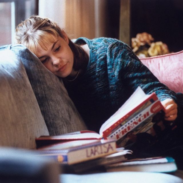 actress larisa oleynik at home reading a book