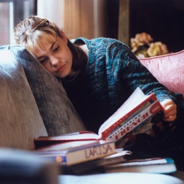 actress larisa oleynik at home reading a book