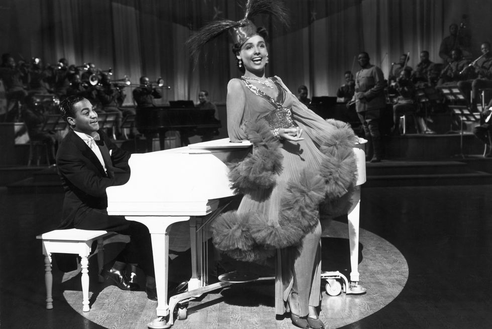 lena horne sings on stage near piano