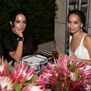 lisa bonet and zoe kravitz sit at a dinner to illustrate a gift guide for mothers day
