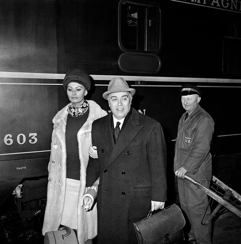 Actress Sophia Loren And Husband Carlo Ponti Arrive At Paris Gare De Lyon To Attend The Premiere Of The Movie 'Five Miles To Midnight'