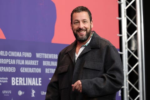 adam sandler wearing a jacket and smiling