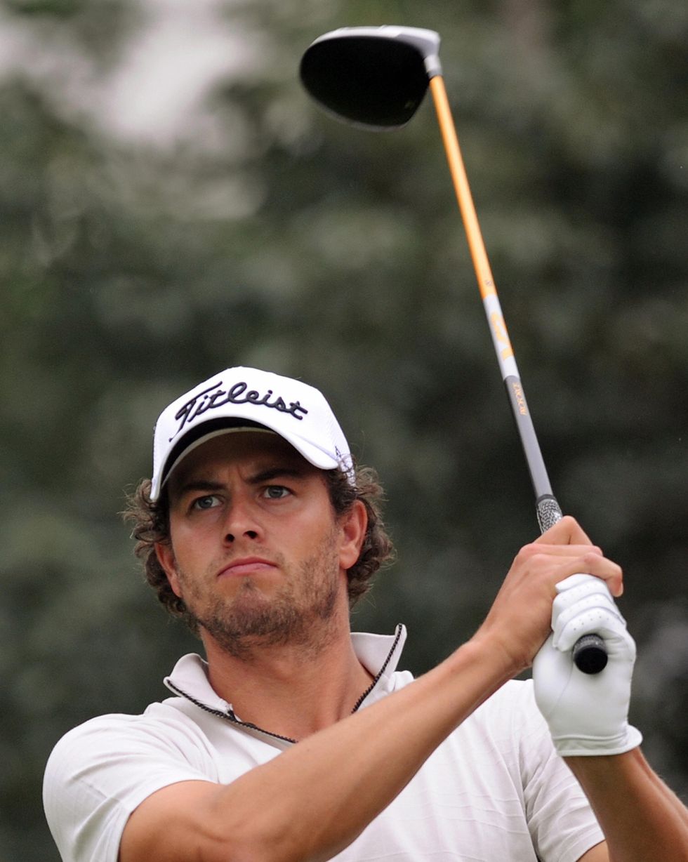 adam scott of australia tees off during