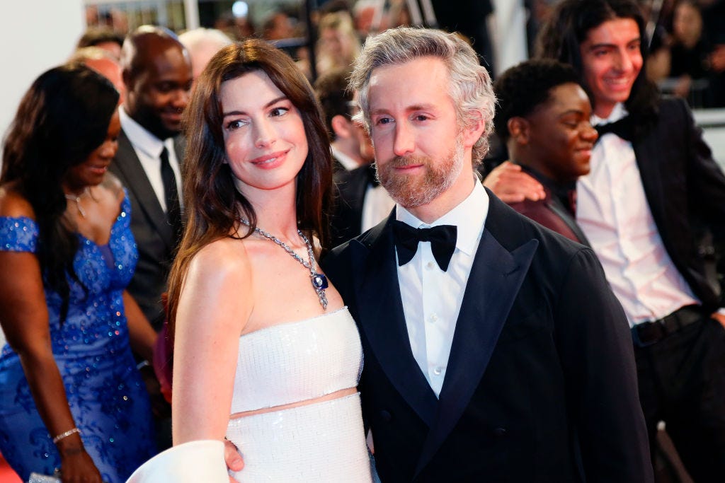 preview for Anne Hathaway stuns in white safety pin dress at the 2023 Met Gala