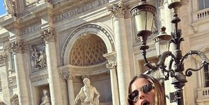 addison rae channels lizzie mcguire in a y2k top and jeans at the trevi fountain, rome