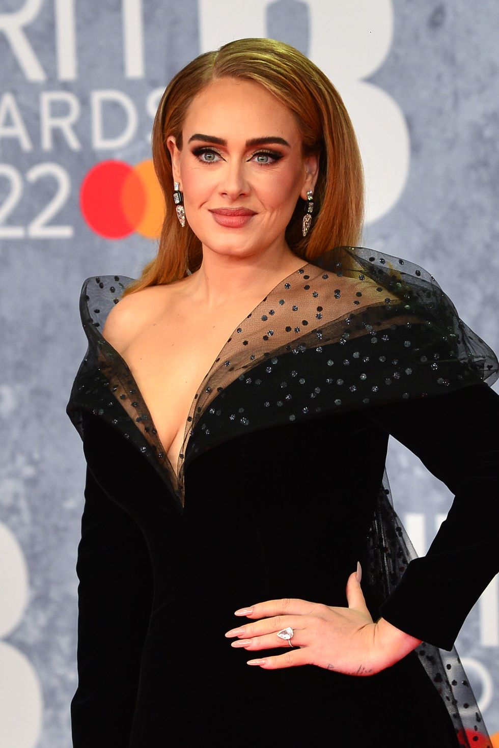 adele at the brit awards 2022 showing off her ring