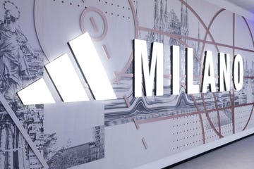 sign displaying milano with a modern design in a branded setting