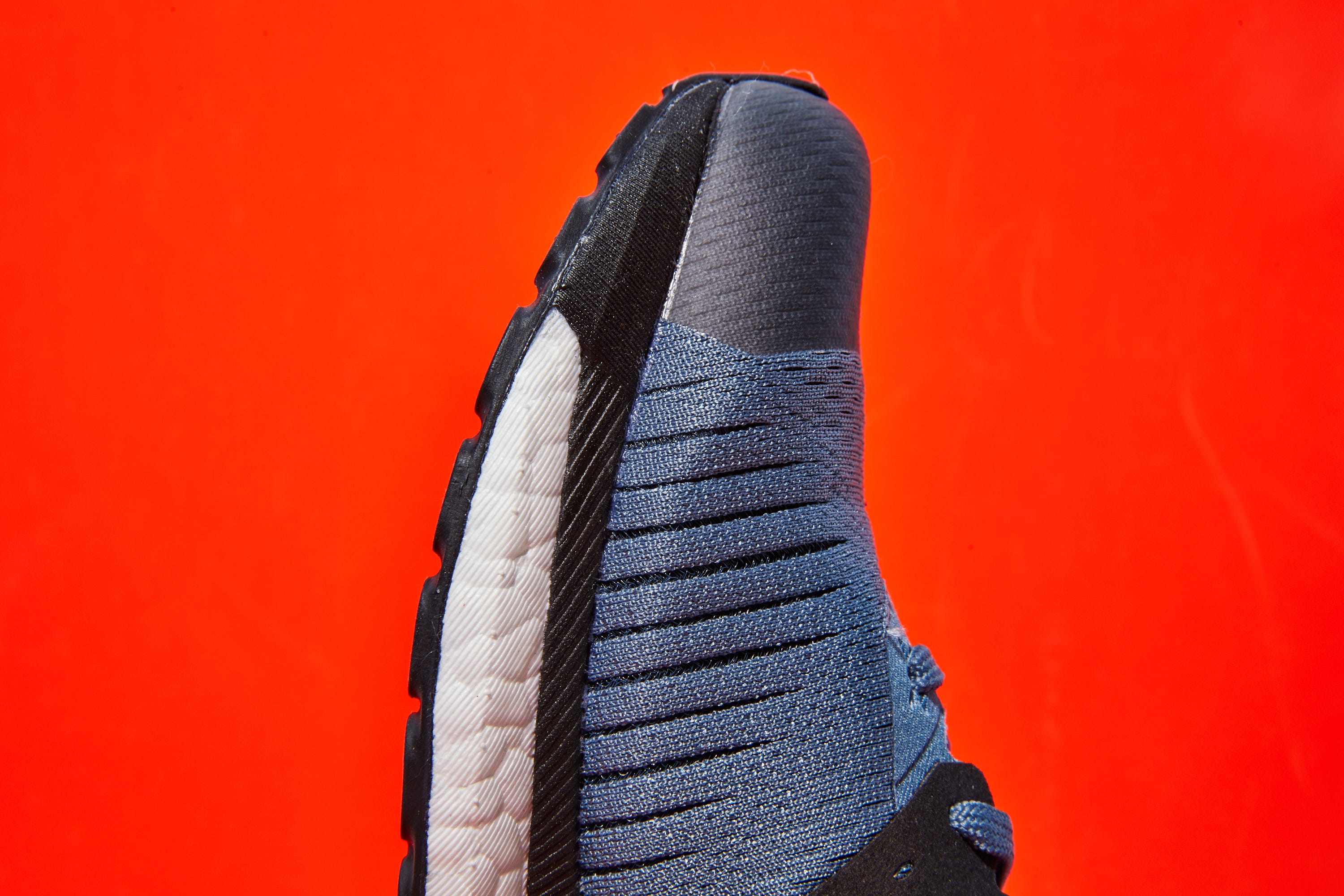 Black, Tire, Red, Footwear, Orange, Synthetic rubber, Automotive tire, Shoe, Tread, Automotive wheel system, 