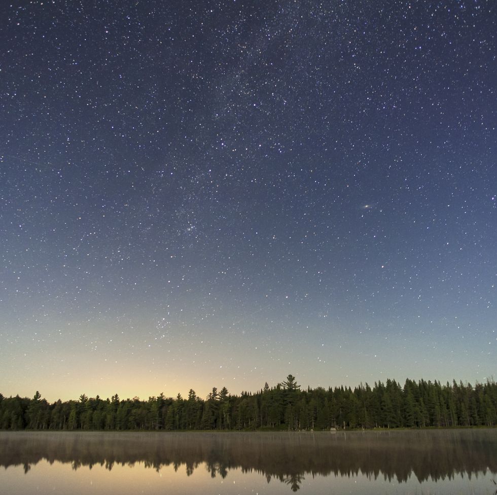 adirondack pond at night with stars