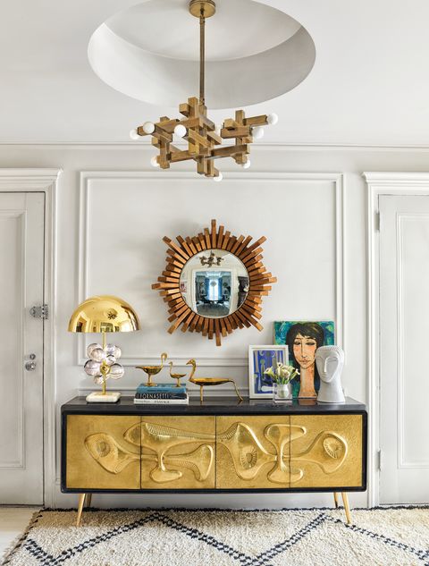 Golden console with mirror and Moroccan rug
