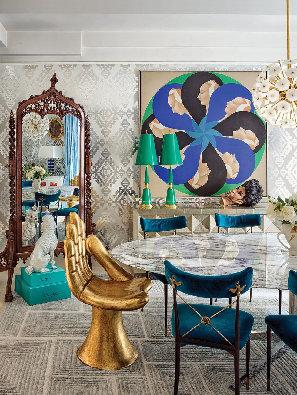 Dining room with gold hand chair, console, geometric run, silver wallpaper
