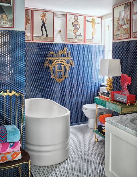 master bath with blue wall tile, white floor tile, deep white  tub