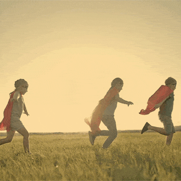 kids running through a field