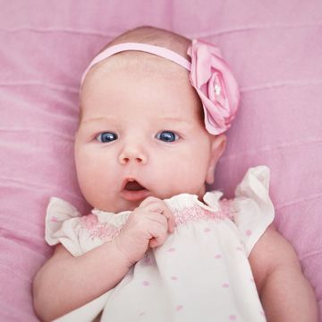 adorable newborn baby girl in pink