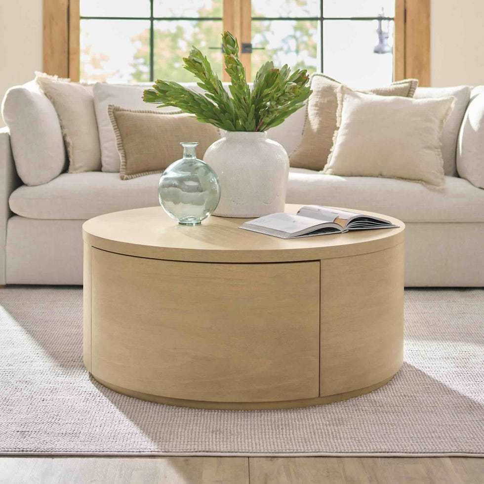 living room scene featuring a round coffee table with decorative elements
