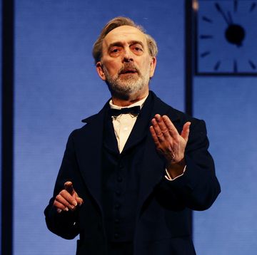 adrian schiller performing on stage during the lehman trilogy show, february 2024