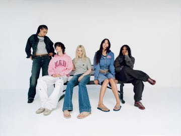 a group of people sitting on a bench