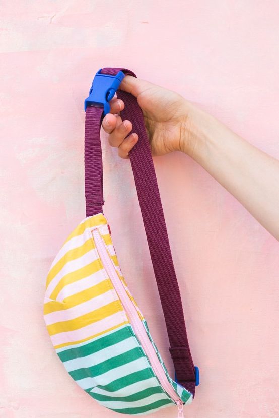 adult craft ideas, hand holding a colorful fanny pack