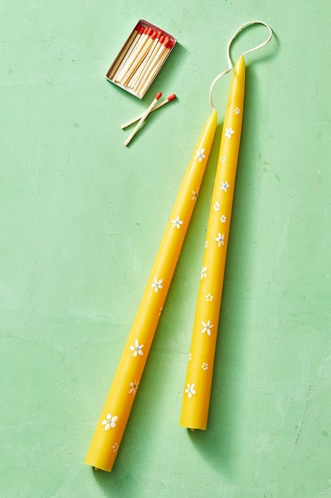 adult craft ideas, two yellow taper candles with floral designs