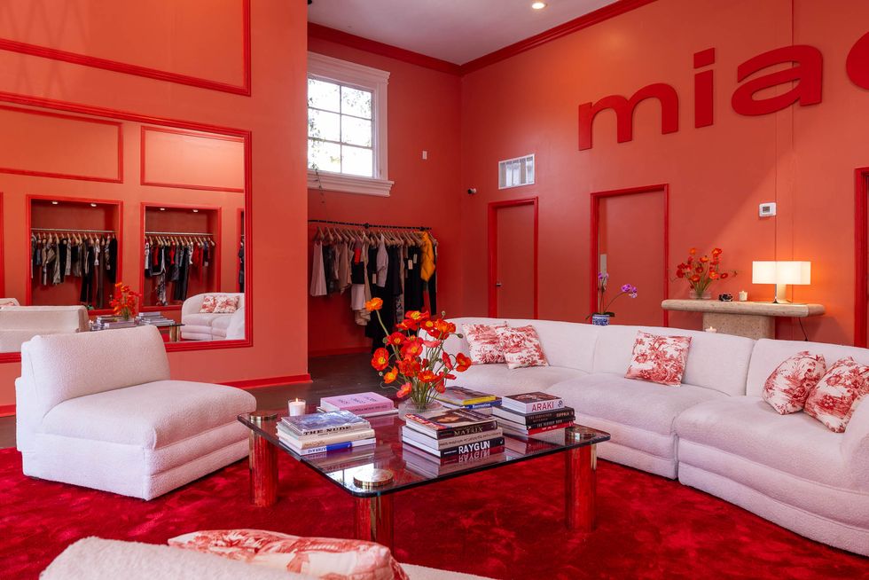a living room with red walls
