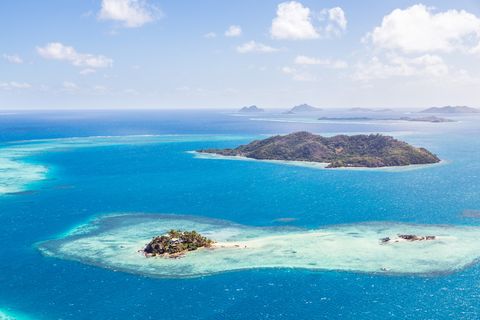 aerial of island with tourist resort fiji