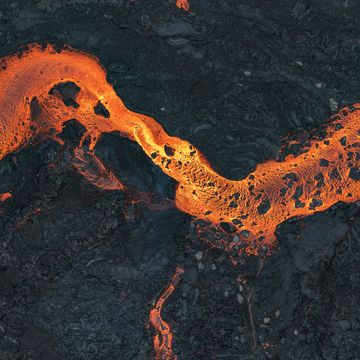 aerial shot looking directly down on a river of lava, iceland
