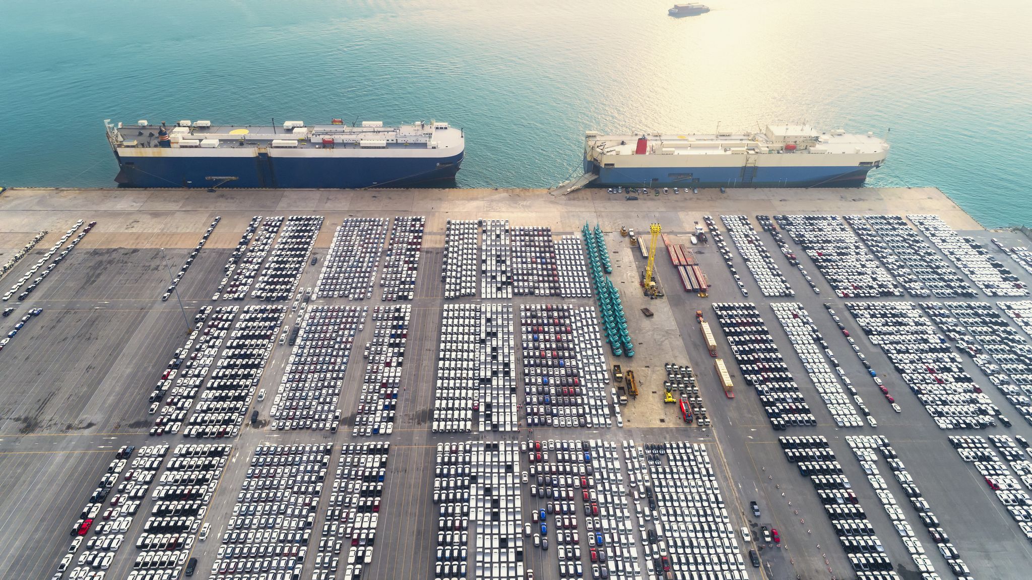 aerial view large roro roll onoff carrier vessels convey cars and trucks at quayside into and out of the world market