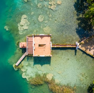 aerial view of ancient fishing house in estany de banyoles lake
