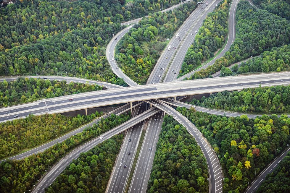 Aerial view of intersecting highways near trees, London, England