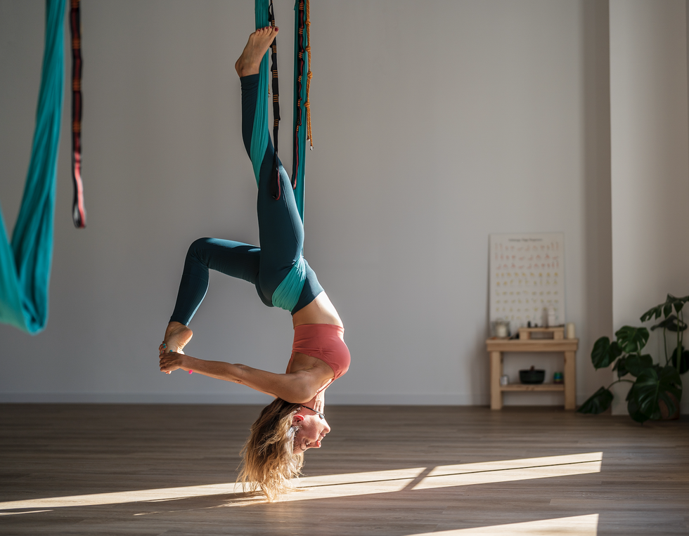 The Benefits of Aerial Yoga & How Practicing It Makes You Feel