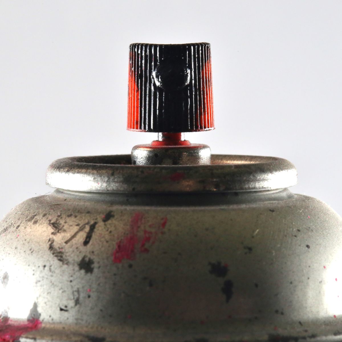 aerosol spray can with paint splatter