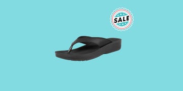 aerothotics flip flop sandal next to a sale sign