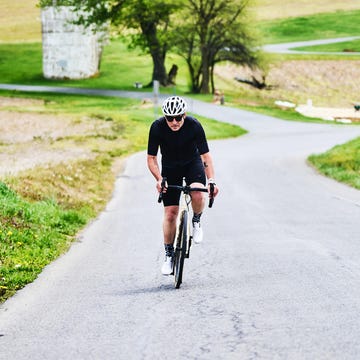 a man riding a bicycle on a road