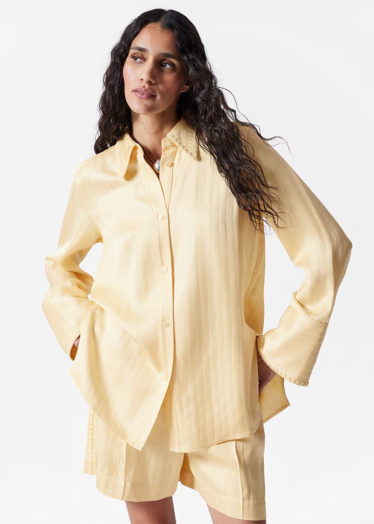 A model is wearing a buttery matching set