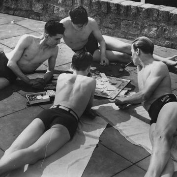 13th may 1939 a group of sunbathers, having a smoke and playing a game of monopoly at an open air pool photo by fox photosgetty images