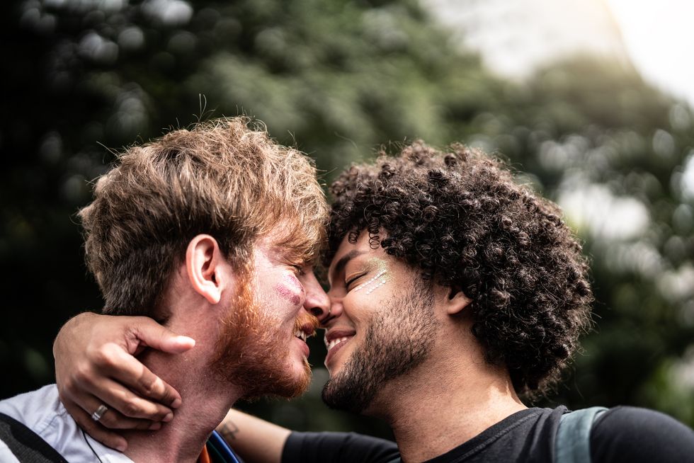 Affection Moment of Gay Couple in Gay Pride Parade