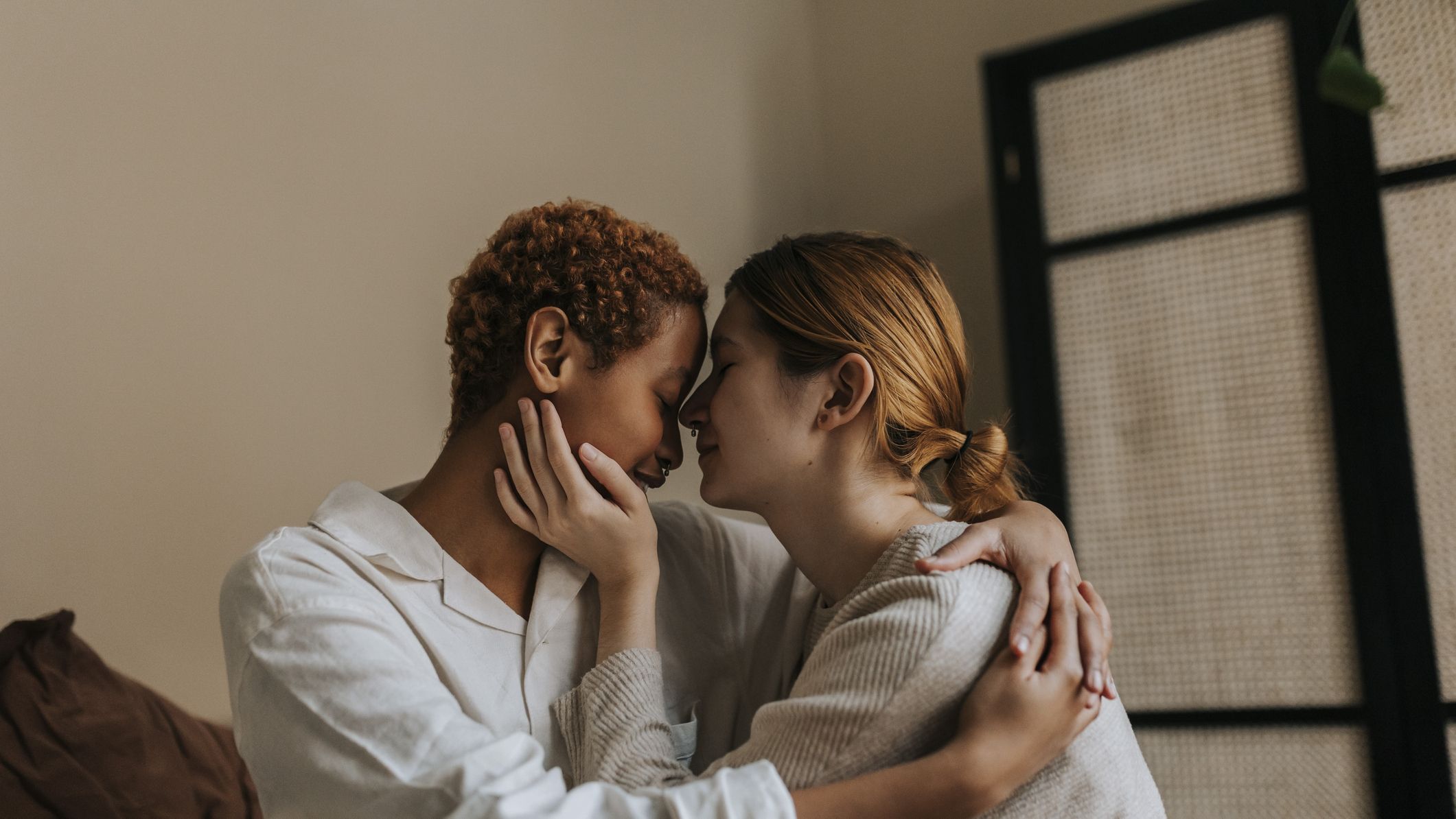 affectionate-non-binary-couple-sitting-at-home-royalty-free-image-1736353992.pjpeg?crop=1xw:0.84415xh;center,top\u0026resize=1200:*