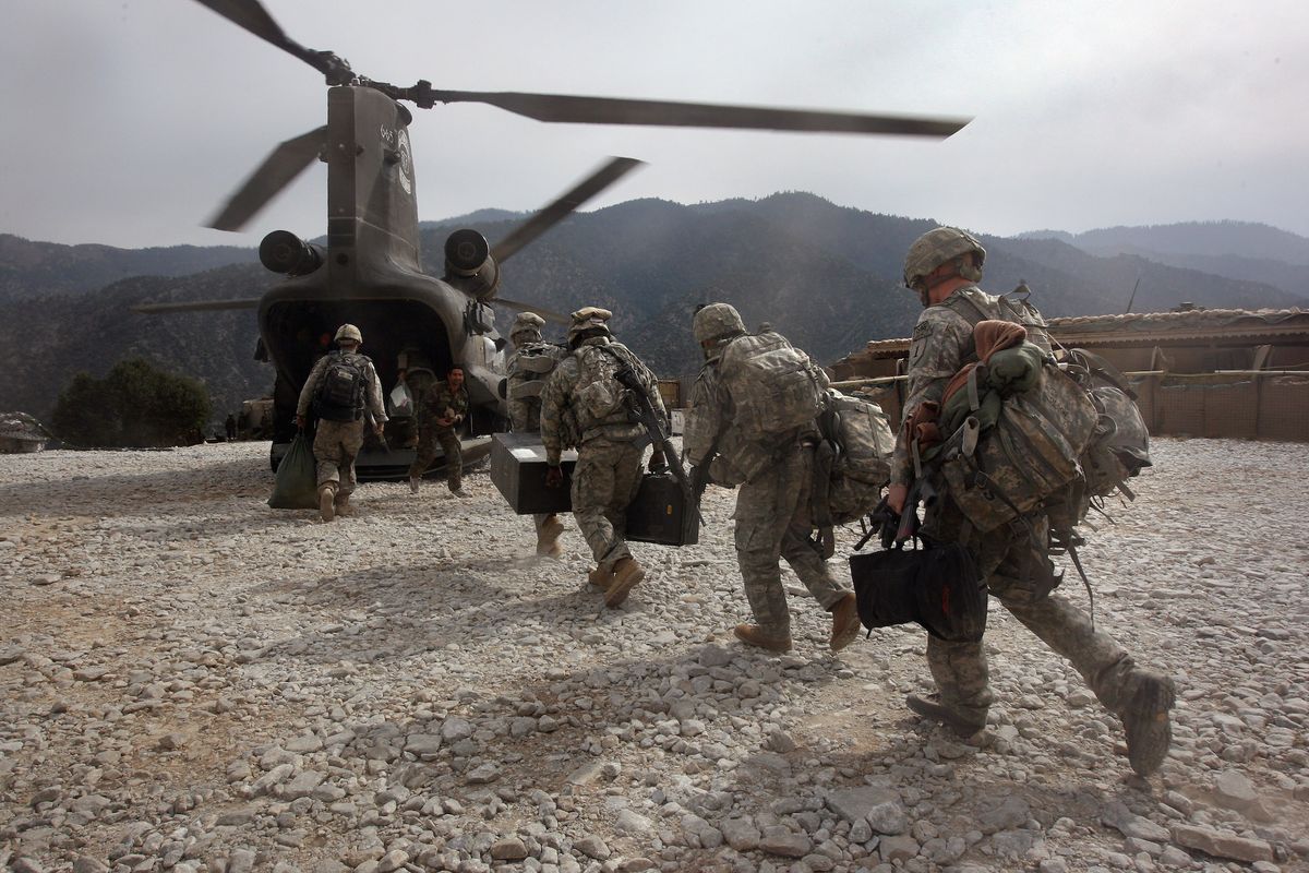 korengal valley, afghanistan   october 27  us soldiers board an army chinook transport helicopter after it brought fresh soldiers and supplies to the korengal outpost on october 27, 2008 in the korengal valley, afghanistan  the military spends huge effort and money to fly in supplies to soldiers of the 1 26 infantry based in the korengal valley, site of some of the fiercest fighting of the afghan war the unpaved road into the remote area is bad and will become more treacherous with the onset of winter  photo by john mooregetty images