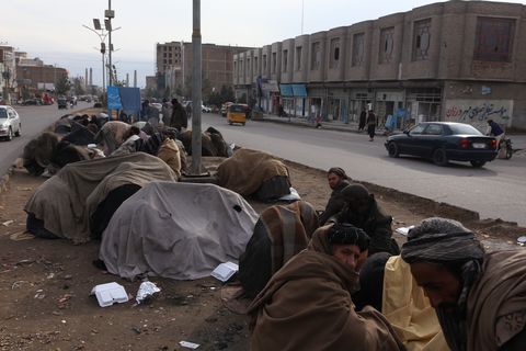 herat, afghanistan   january 10 homeless and drug addicts people are seen at musalla street in herat, afghanistan on january 10, 2022 drug addicts gather in groups of two or three in the city center and continue to use drugs without any intervention some of the drug addicts who live in a corner, under a bridge or on a deserted street in the city center make a living by helping people those working in business lines such as bakeries, greengrocers, construction, and some by collecting paper and plastic from garbage the others openly admit that they steal and beg photo by bilal guleranadolu agency via getty images