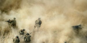 us soldiers gather near a destroyed vehicle and protect their faces from rotor wash, as their wounded comrades are airlifted by a medevac helicopter from the 159th brigade task force thunder to kandahar hospital role 3, on august 23, 2011  three soldiers were wounded while their vehicle was destroyed up by an improvised explosive devise ied all foreign combat troops will leave afghanistan by the end of 2014 in a process that started last month and will require the afghan army and police to play an ever greater role in fighting the taliban insurgency  afp photo johannes eisele photo credit should read johannes eiseleafp via getty images