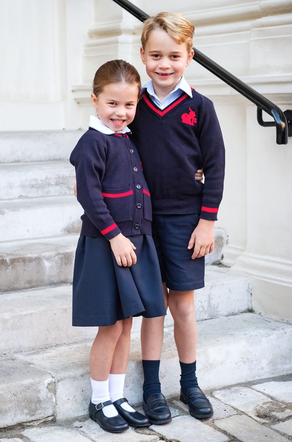 a boy and girl in school uniforms