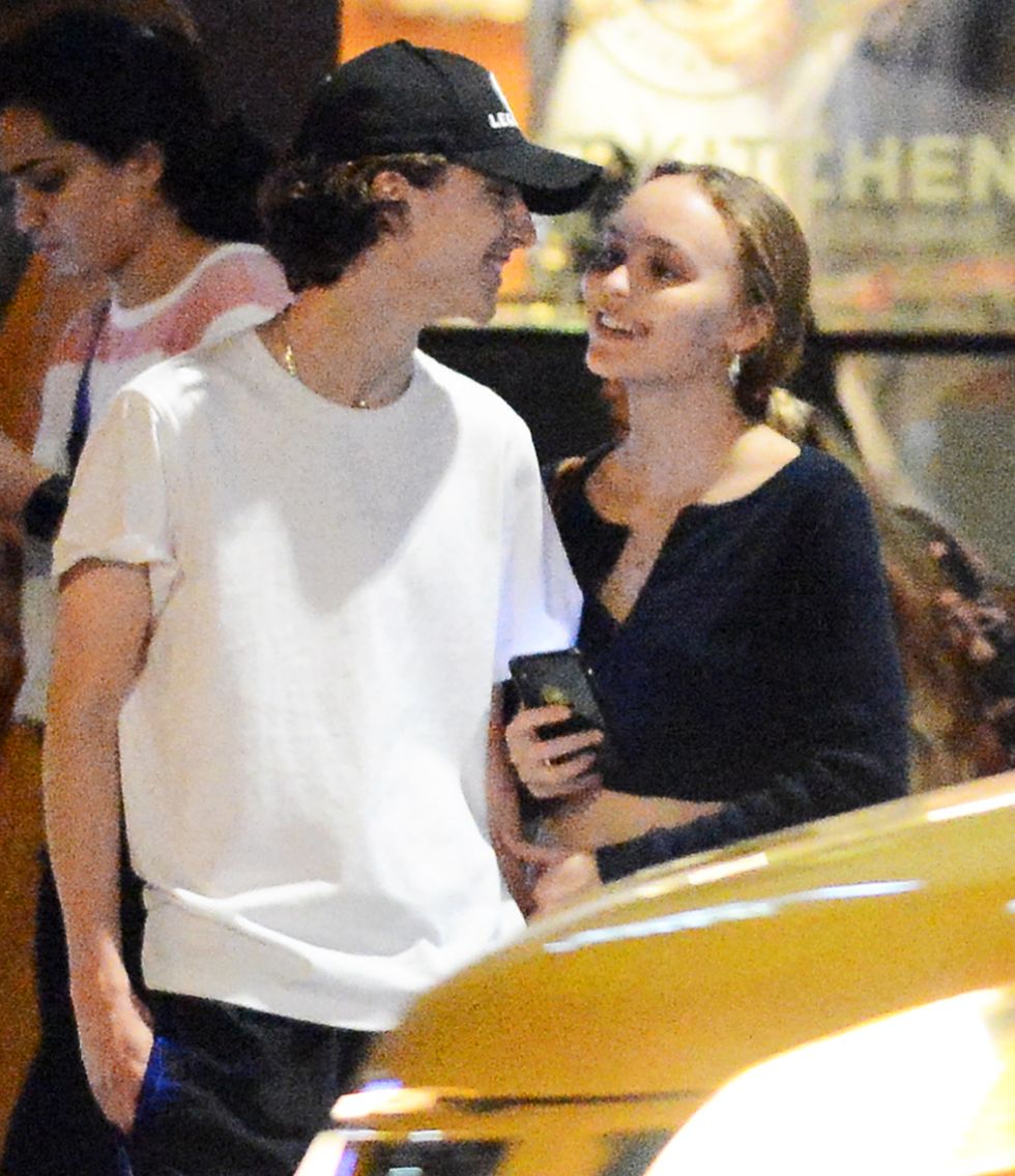 09232019 exclusive timothee chalamet and lily rose depp step out for an evening together in new york city the 20 year old model and actress wore a black crop top, ripped jeans, and white trainers chalamet, 23, wore a baseball cap, t shirt, black sweats, and white trainers salestheimagedirectcom please bylinetheimagedirectcomexclusive please email salestheimagedirectcom for fees before use