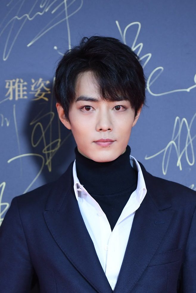 file  chinese actor and singer xiao zhan, member of the male idol group x nine poses as he arrives on the red carpet for the 2018 marie claire style china artistry party in beijing, china, 17 december 2018