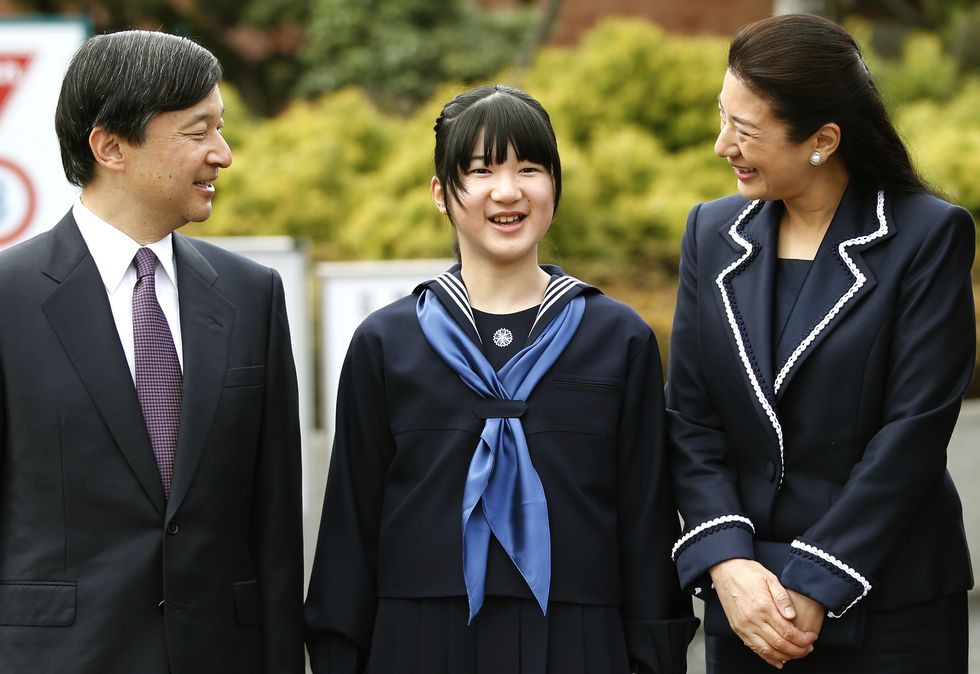japan's princess aiko, center, accompanied by her parents crown prince naruhito, left, and crown princess masako, answers a reporter's question as they attend her entrance ceremony at the gakushuin girls' junior high school in tokyo sunday, april 6, 2014 ap phototoru hanai, pool